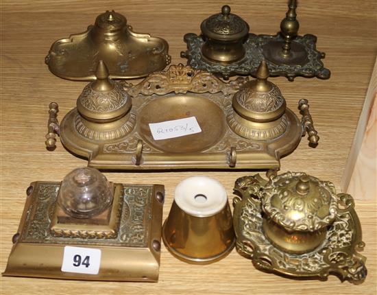 A military inkwell and a collection of brass inkstands